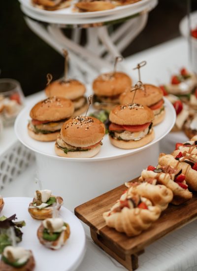 welcome buffet with alcohol and snacks, sandwiches, cupcakes